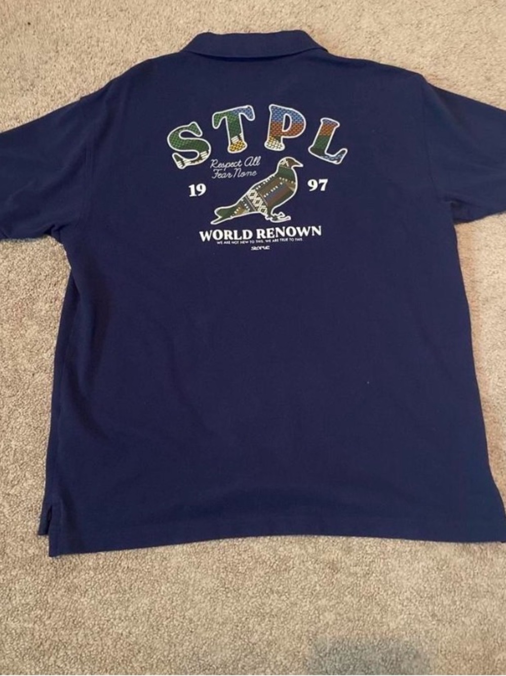 Staple Navy Polo with Multicolor STPL Back Graphic